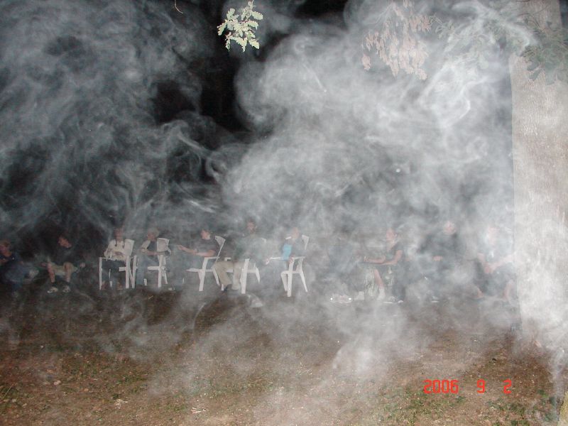 Now, this photo is very strange.  As you can see from the one immediately before, all fires were burning clean and hot.  There was nothing in the vicinity of the camera to produce smoke.  The fire was to the left and the tiki torch was some distance away.  So, where did the smoke come from?  Ark says there was no smoke around him, none in the digital viewfinder, but yet there is this strange smoke...