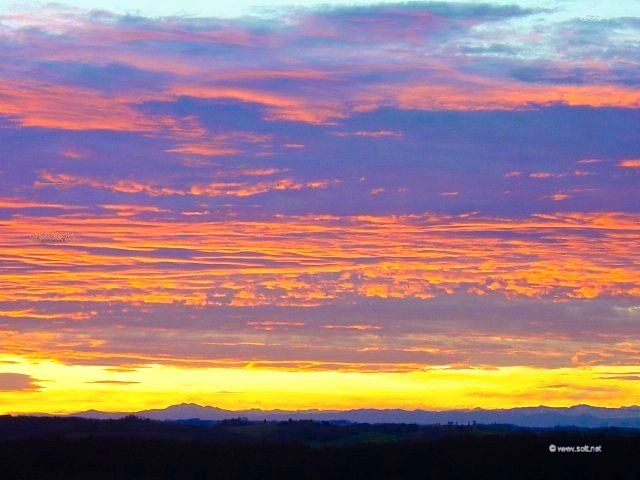 Sunset over the Pyrenees in the distance, photographed from Gascony.