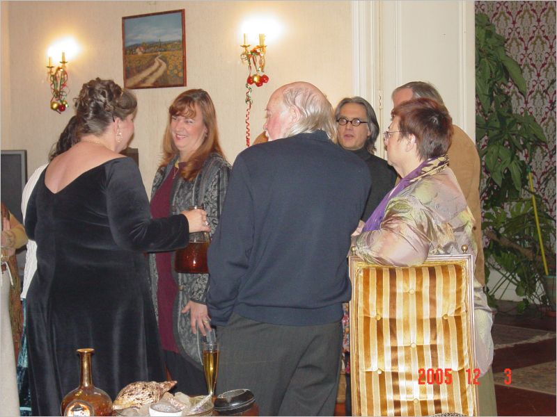 Laura, in black, greets her guests...