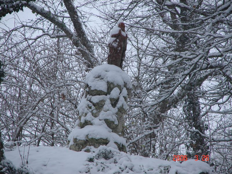 The Statue on top of the Mound in the Snow